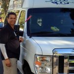 QTS of Arizona Driver Luis Gomez places a red ribbon on his van to remind the public not to drink and drive this holiday season